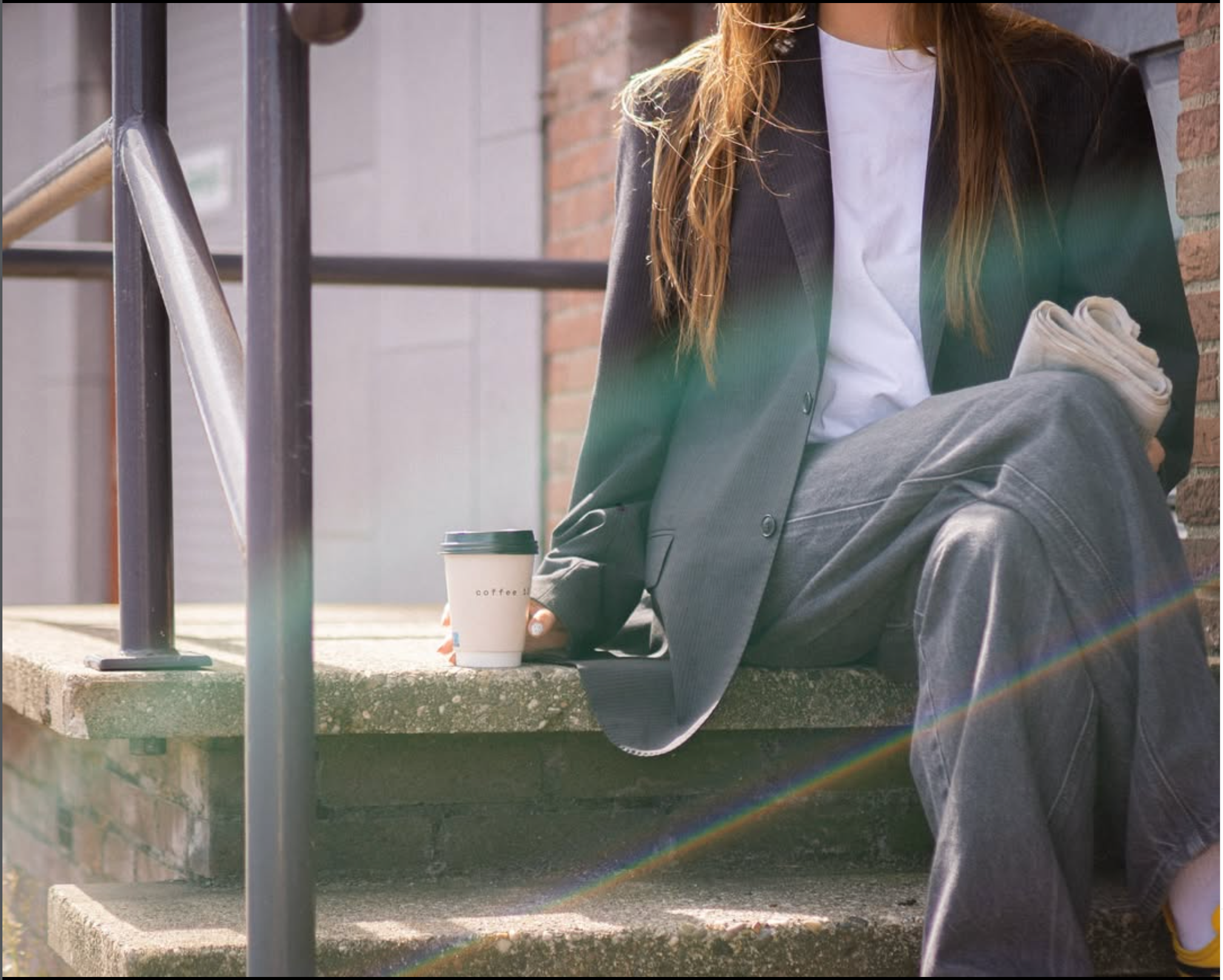 Coffee to go on sunlit steps